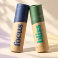 Blue Focus and green Bliss tubes touching in warm cream studio light